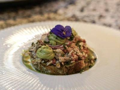 Crab with avocado on toasted bread