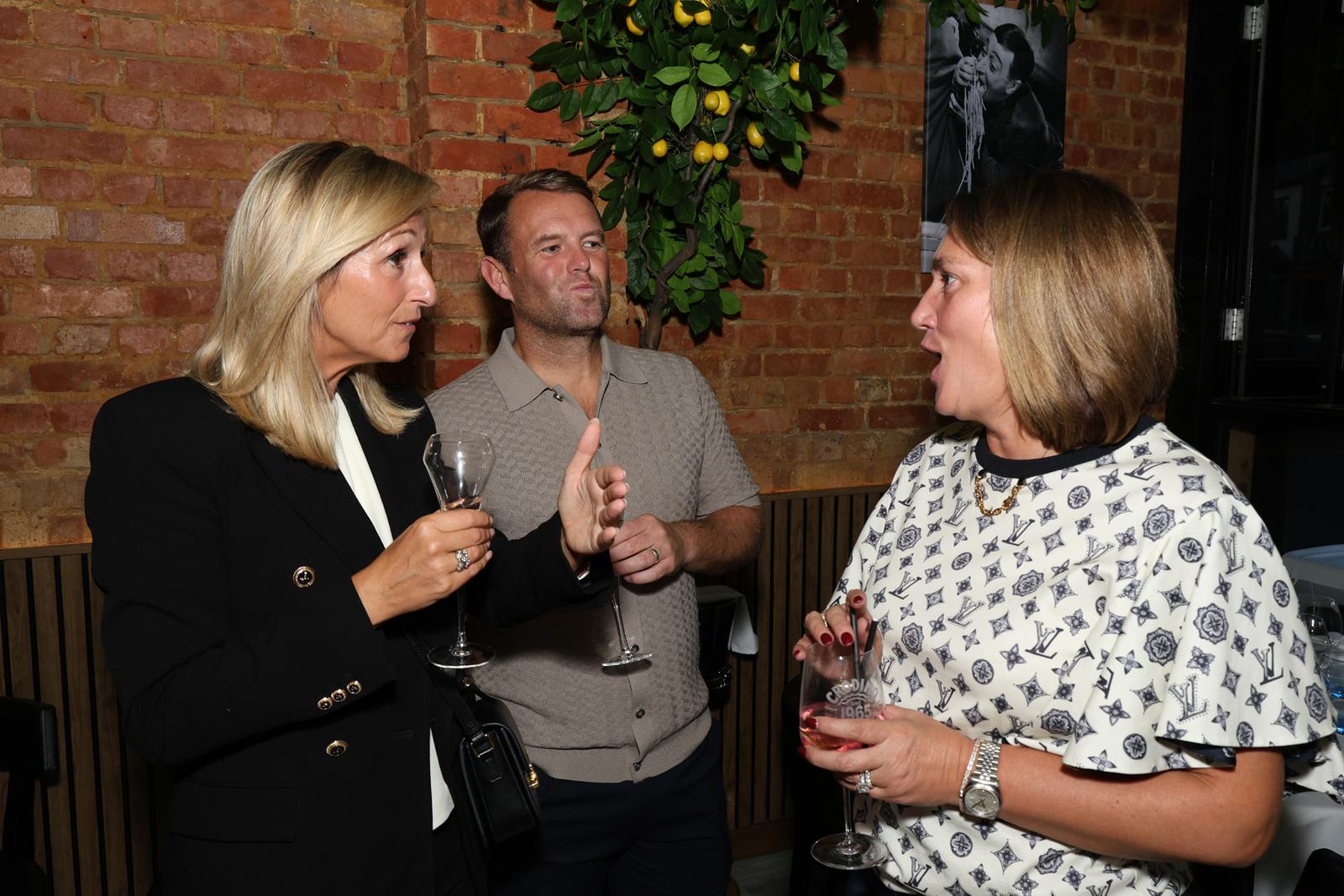 Conversation by the brick wall
