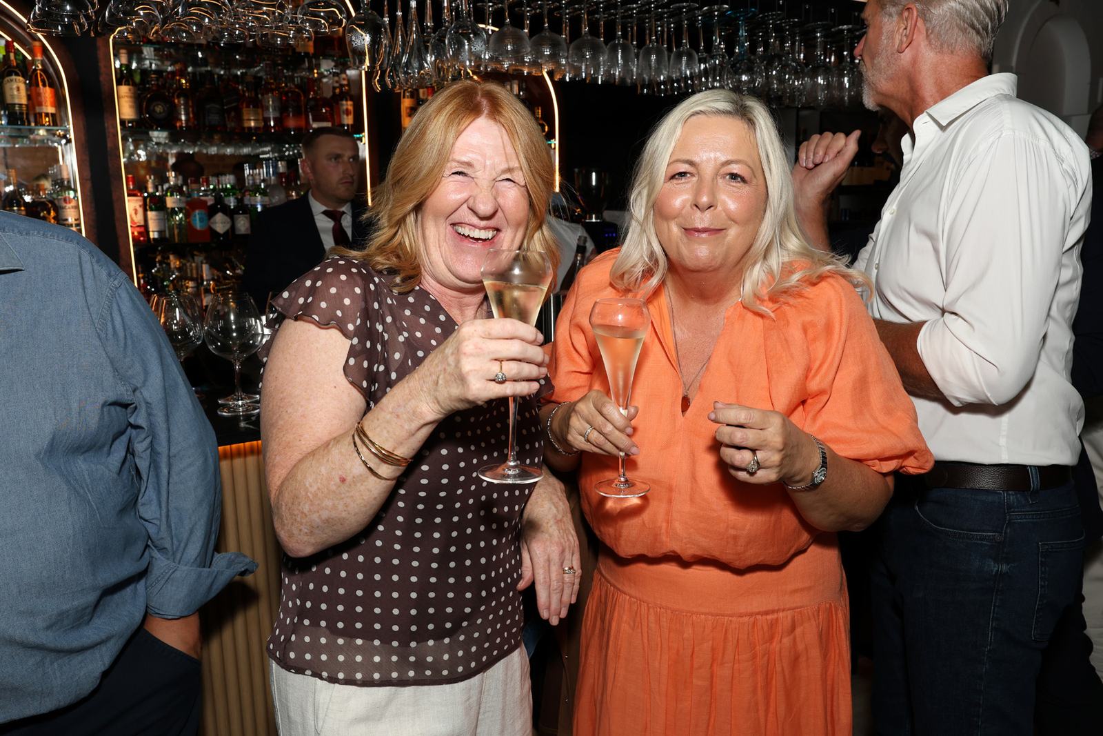 Guests raising a glass to Bella Roma Locksbottom