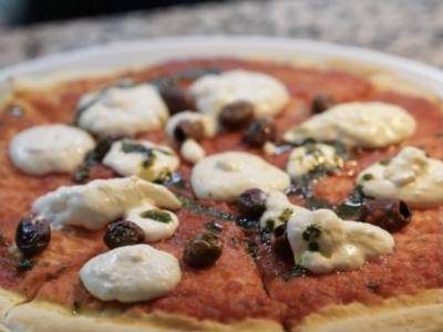 Pizza with burrata and olives